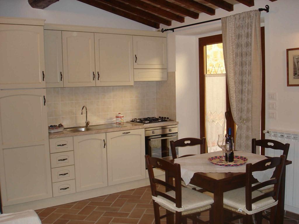 Apartamento La Corte Antica Pienza Habitación foto